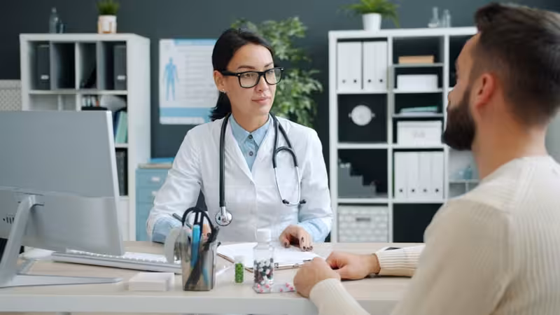 How to Choose a Trustworthy Ear Wax Removal Service: A doctor in a clinic Doctor in clinic for How to Choose a Trustworthy Ear Wax Removal Service - Best Guide To Ashford: Private Microsuction Ear W...