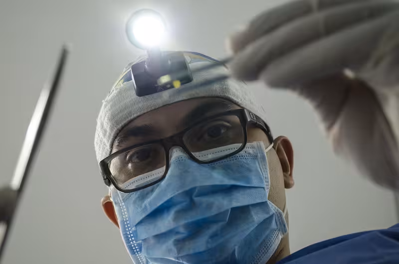 What Happens at a Private Ear Wax Appointment: A doctor in a clinic Doctor in clinic for What Happens at a Private Ear Wax Appointment - Best Guide To Ashford: Private Microsuction Ear Wax Rem...