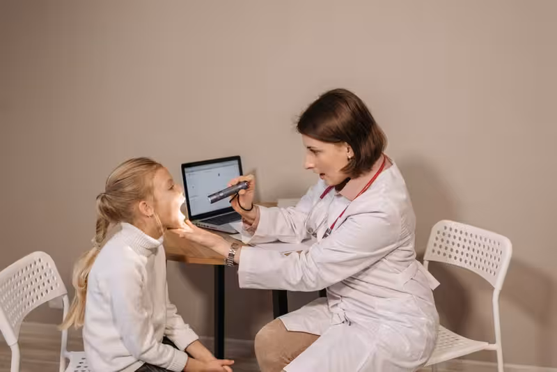 Symptoms Worth Raising During Your Consultation: A doctor in a clinic Doctor in clinic for Symptoms Worth Raising During Your Consultation - Cambridge: Private Microsuction Ear Wax Removal In Ca...